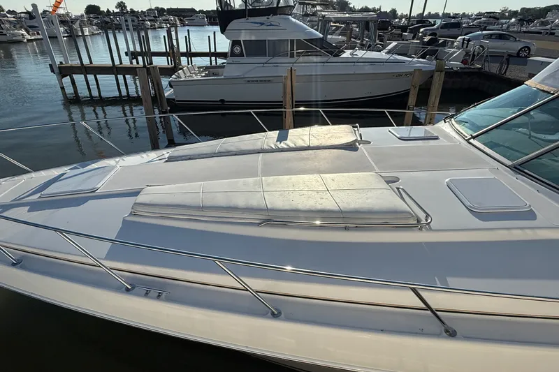 Slide: The Image of 2000 Formula 41 Performance Cruiser docked at marina, featuring spacious sunbathing deck. - 5