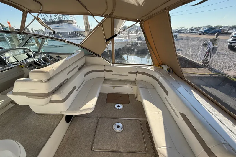 Slide: The Image of Interior of a 2000 Formula 41 Performance Cruiser with beige seating and helm. - 10