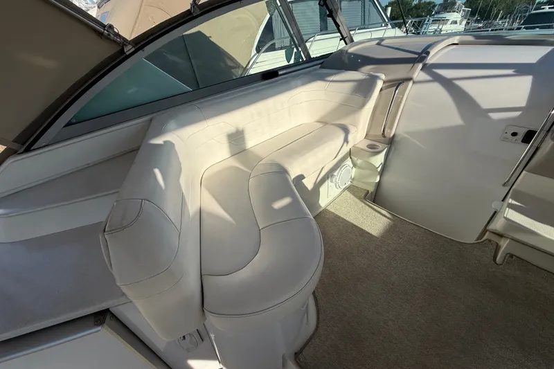 Slide: The Image of Interior of 2000 Formula 41 Performance Cruiser with white seating and carpeted floor. - 18