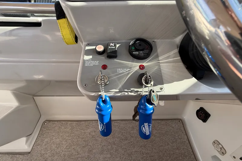 Slide: The Image of Control panel of a 2000 Formula 41 Performance Cruiser with ignition keys and switches. - 34