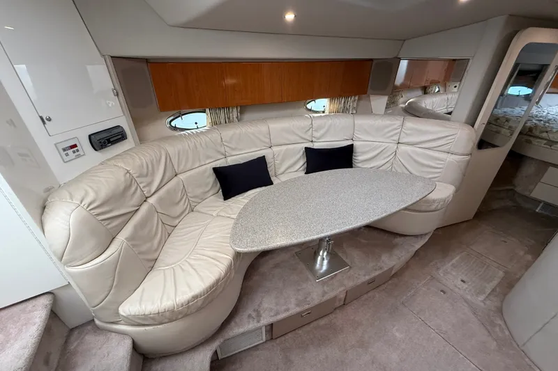 Slide: The Image of Luxurious interior of 2000 Formula 41 Performance Cruiser with plush seating and modern table. - 39