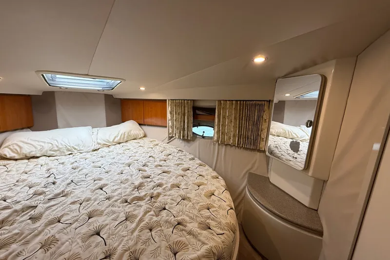 Slide: The Image of Cozy cabin interior of 2000 Formula 41 Performance Cruiser with bed and porthole window. - 52