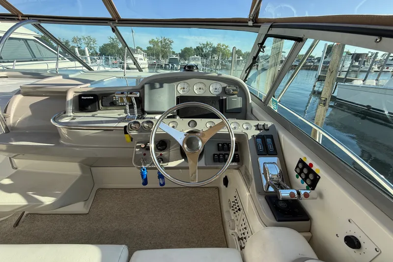 Slide: The Image of Cockpit of 2000 Formula 41 Performance Cruiser with steering wheel and control panel. - 25