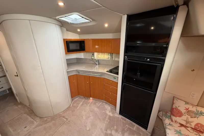 Slide: The Image of Interior of 2000 Formula 41 Performance Cruiser with kitchenette and modern appliances. - 36