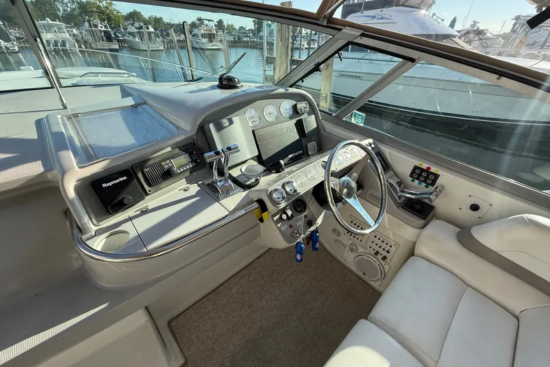 Slide: The Image of Cockpit of 2000 Formula 41 Performance Cruiser with steering wheel and navigation instruments. - 24