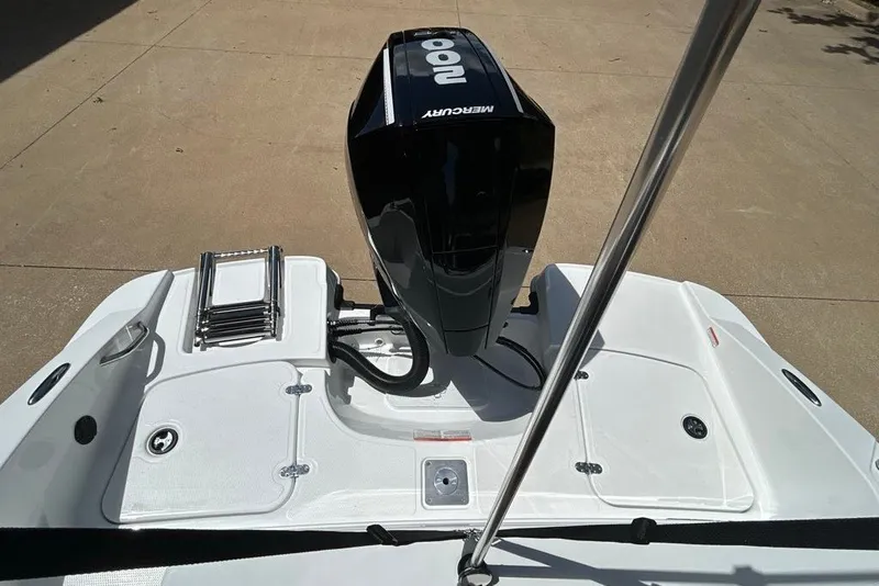 Slide: The Image of 2027 Tahoe 2150 boat with Mercury outboard motor and swim platform ladder. - 2