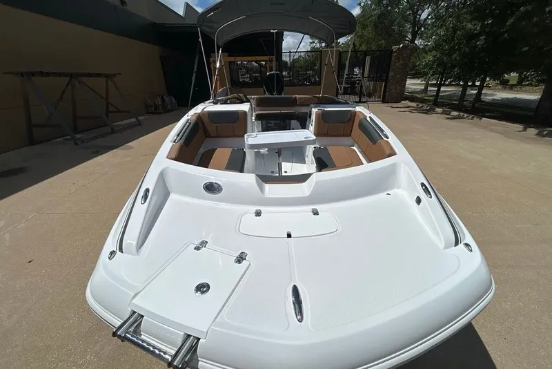 Slide: The Image of 2027 Tahoe 2150 boat with spacious seating and sleek design on display. - 9