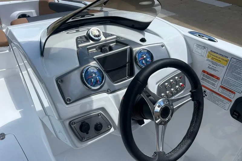 Slide: The Image of Steering console of 2027 Tahoe 2150 boat with gauges and controls. - 4