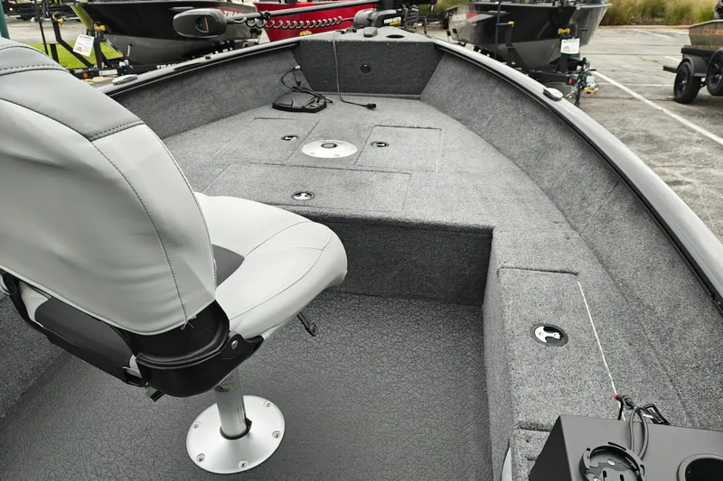 Slide: The Image of 2027 Tracker Super Guide V-16 T boat interior with seating and storage compartments. - 17