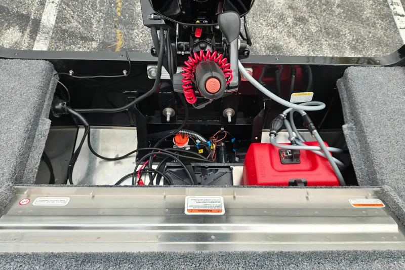 Slide: The Image of Interior view of 2027 Tracker Super Guide V-16 T boat engine compartment. - 28