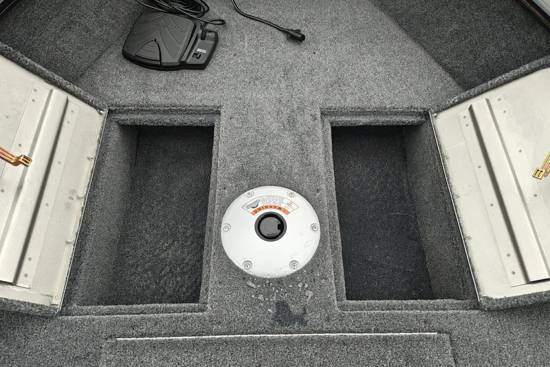 Slide: The Image of Interior of 2027 Tracker Super Guide V-16 T boat with storage compartments. - 22