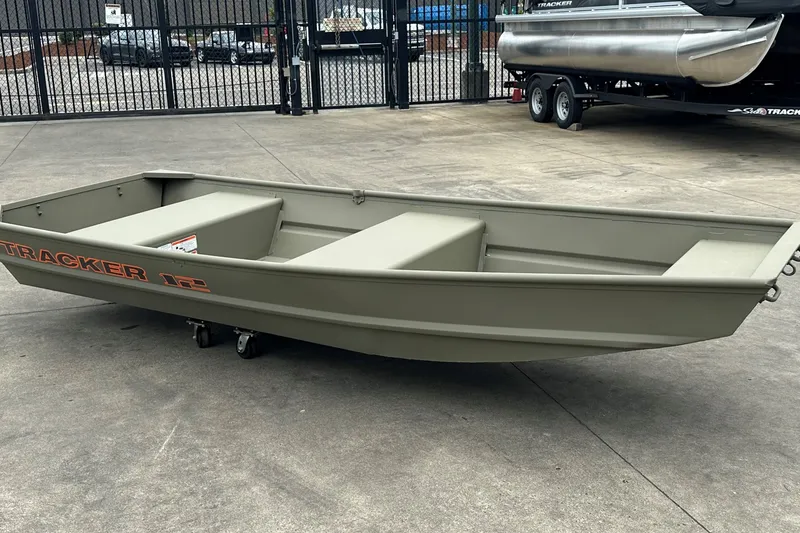 The Image of 2027 Tracker Grizzly 12 Jon boat on concrete surface, showcasing durable design. - 0