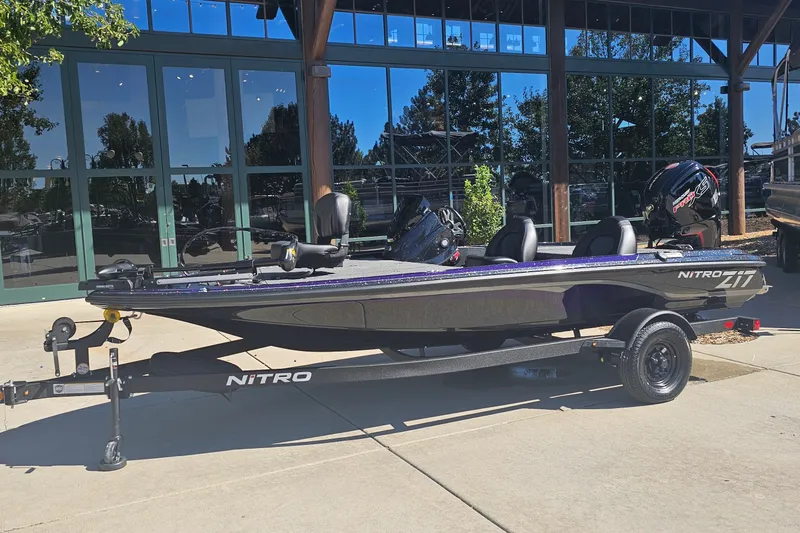 The Image of 2027 Nitro Z17 boat on trailer, parked outdoors near a building. - 0