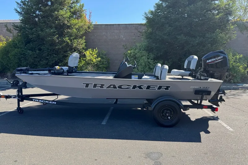 The Image of 2027 Tracker Pro 170 boat with Mercury engine on trailer, parked outdoors. - 0