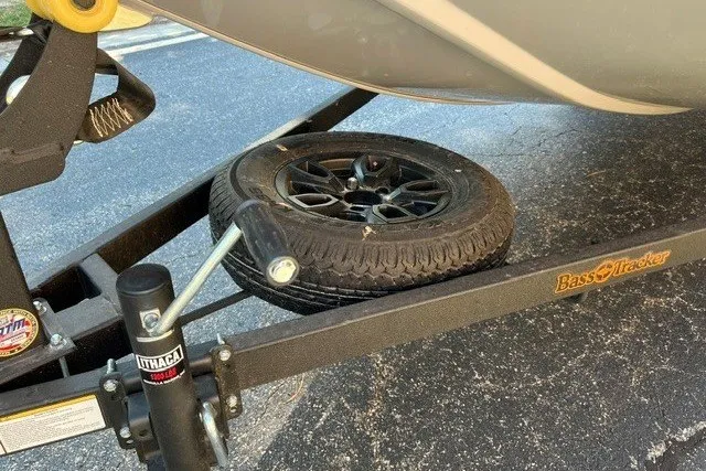 Slide: The Image of Trailer hitch and spare tire of 2027 Tracker Bass Tracker Classic Limited boat. - 13