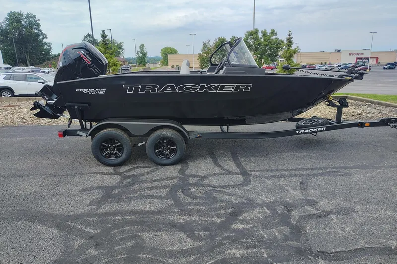 The Image of 2027 Tracker Pro Guide V-175 WT boat on trailer in parking lot. - 0