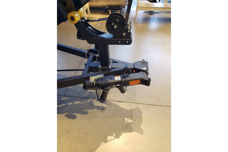 Slide: The Image of Trailer hitch of 2027 Tracker Bass Tracker Classic XL boat, indoors on display. - 18
