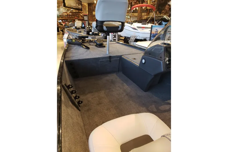 Slide: The Image of 2027 Tracker Bass Tracker Classic XL interior with seating and fishing equipment. - 15