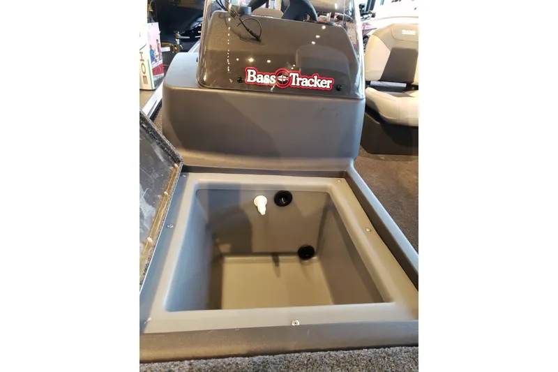 Slide: The Image of 2027 Tracker Bass Tracker Classic XL boat interior with storage compartment open. - 17