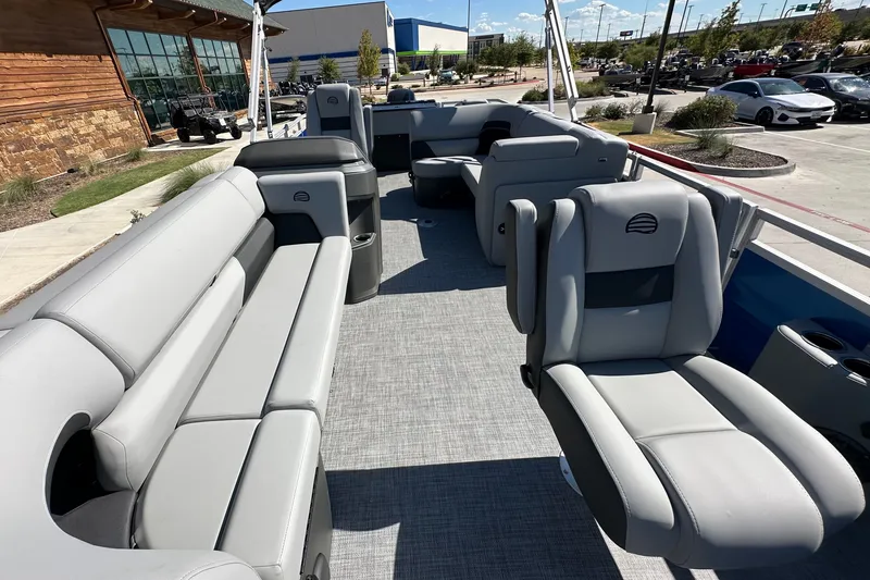 Slide: The Image of 2027 Sun Tracker SportFish 20 DLX pontoon boat with spacious seating and modern design. - 24