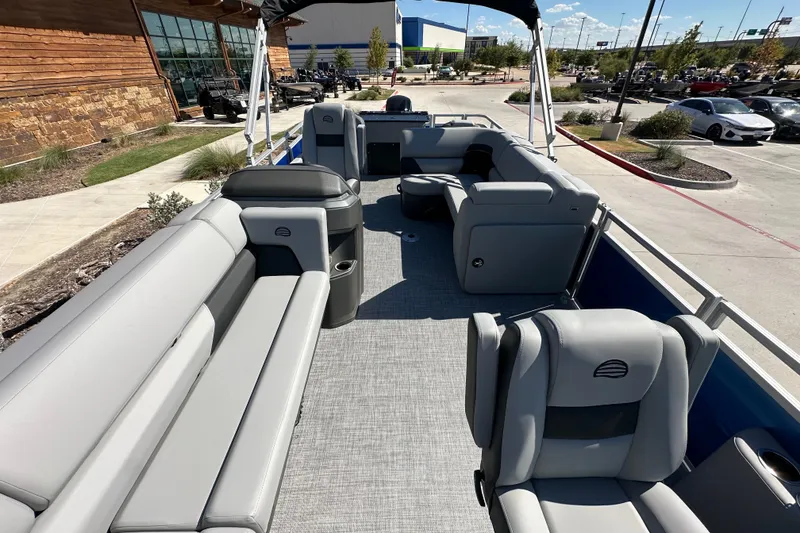 Slide: The Image of 2027 Sun Tracker SportFish 20 DLX pontoon boat with spacious seating and modern design. - 23