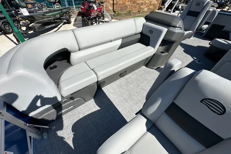 Slide: The Image of 2027 Sun Tracker SportFish 20 DLX boat interior with gray seating and cup holders. - 32
