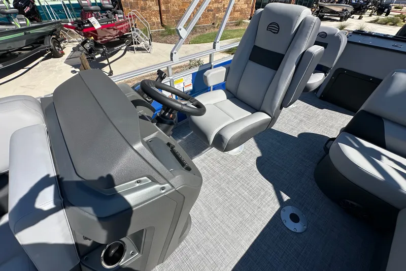 Slide: The Image of Interior of 2027 Sun Tracker SportFish 20 DLX pontoon boat with gray seating and steering console. - 19