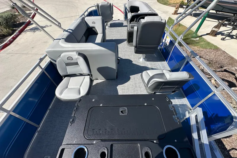 Slide: The Image of 2027 Sun Tracker SportFish 20 DLX pontoon boat interior with seating and helm. - 25