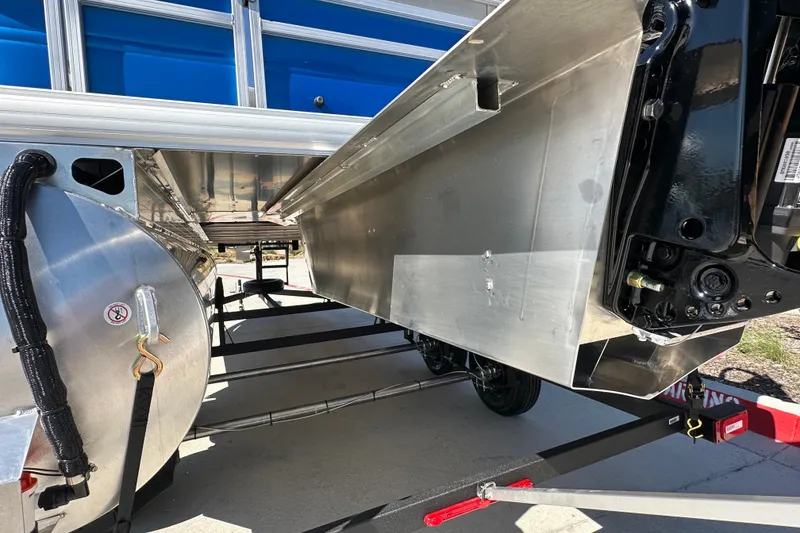 Slide: The Image of Underneath view of 2027 Sun Tracker SportFish 20 DLX pontoon boat on trailer. - 16