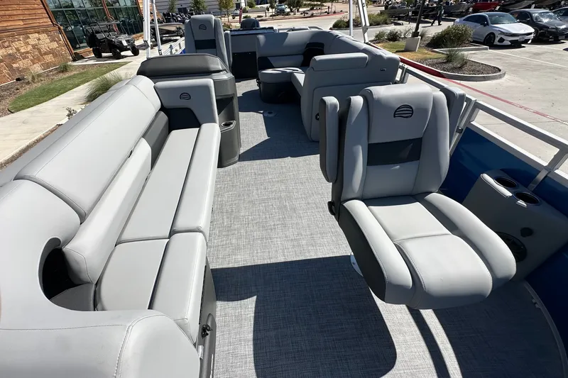 Slide: The Image of Interior of 2027 Sun Tracker SportFish 20 DLX pontoon boat with gray seating. - 17