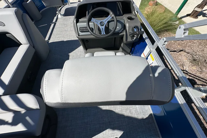 Slide: The Image of 2027 Sun Tracker SportFish 20 DLX boat interior with steering wheel and seating. - 18