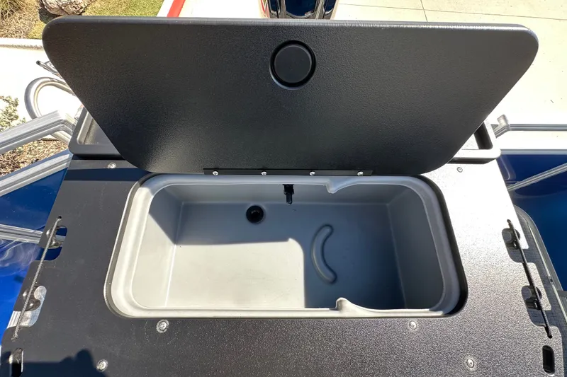 Slide: The Image of Open storage compartment on 2027 Sun Tracker SportFish 20 DLX boat. - 27