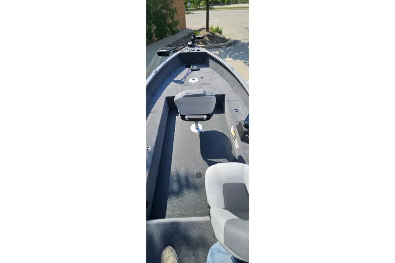 Slide: The Image of 2027 Tracker Super Guide V-16 T boat interior with seating and steering console. - 39