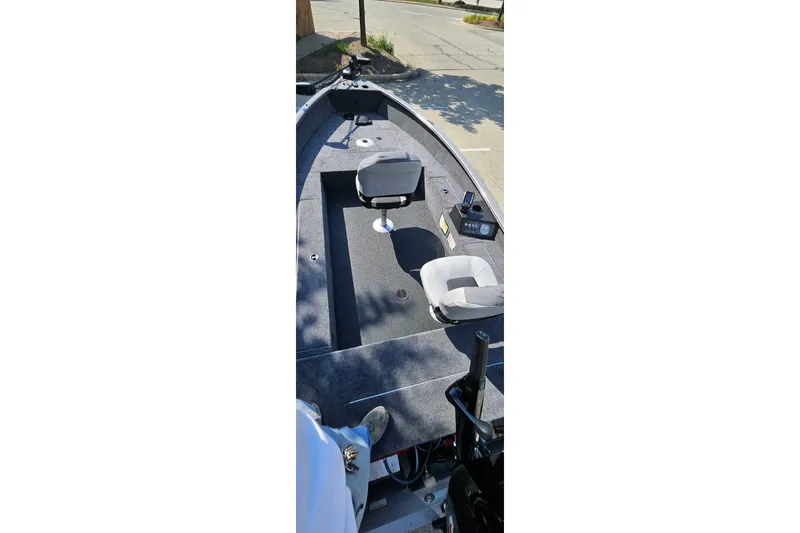 Slide: The Image of 2027 Tracker Super Guide V-16 T fishing boat interior with seating and control panel. - 40