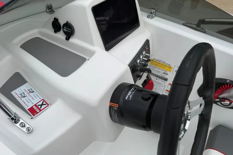 Slide: The Image of Steering console of 2027 Tahoe T18 boat with modern controls and dashboard. - 6