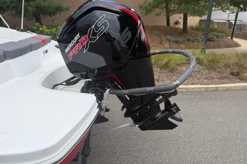 Slide: The Image of 2027 Tahoe T18 boat with Mercury Pro XS outboard motor, parked outdoors. - 8
