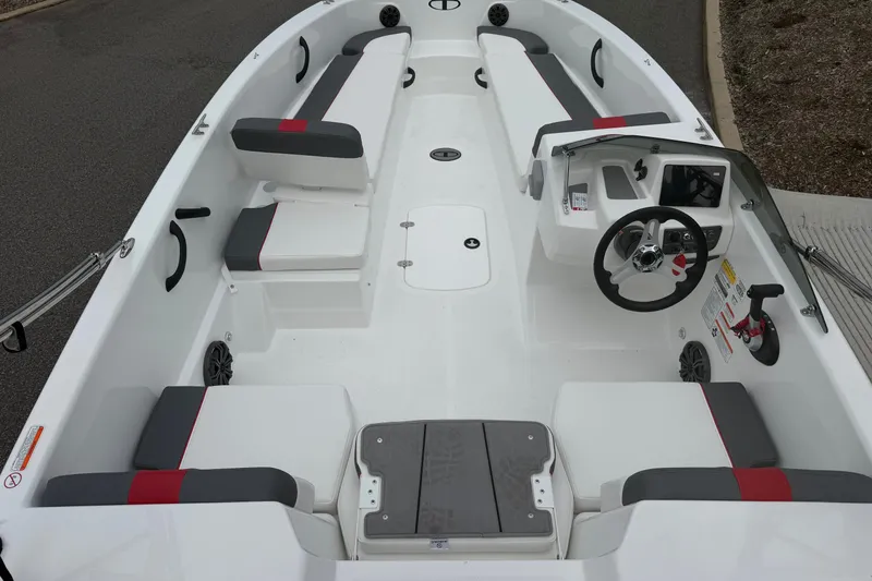 Slide: The Image of 2027 Tahoe T18 boat interior with modern seating and steering console. - 4