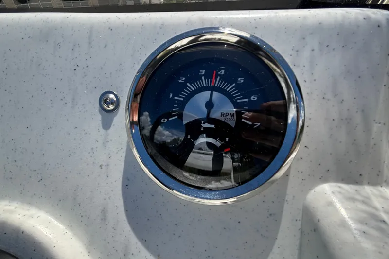 Slide: The Image of Tachometer on 2027 Mako Pro Skiff 17 CC boat dashboard, showing RPM. - 13