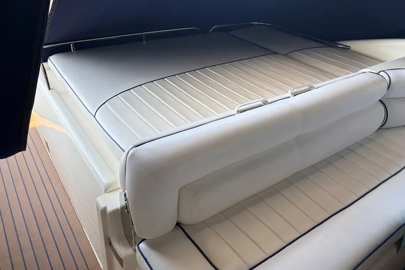 Slide: The Image of Luxurious Sunseeker Camargue 51 yacht interior, featuring elegant white leather seating, 1997 model. - 10