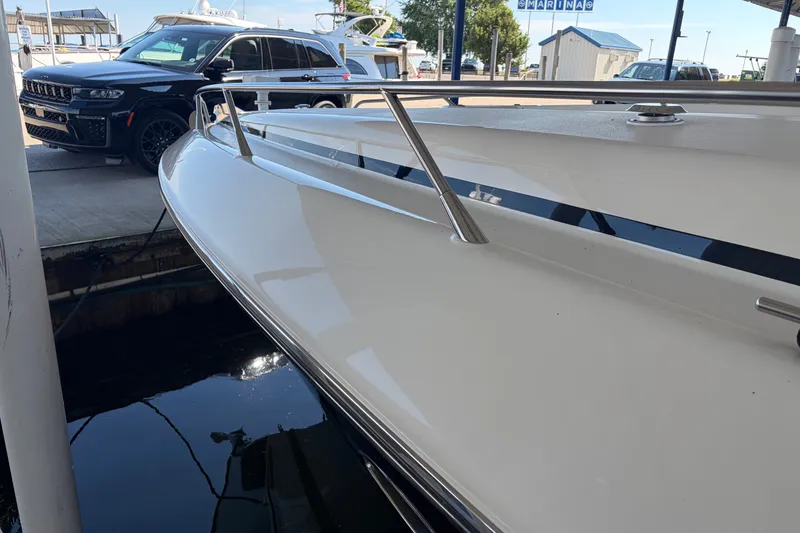 Slide: The Image of 1997 Sunseeker Camargue 51 yacht docked beside a luxury SUV at marina. - 7