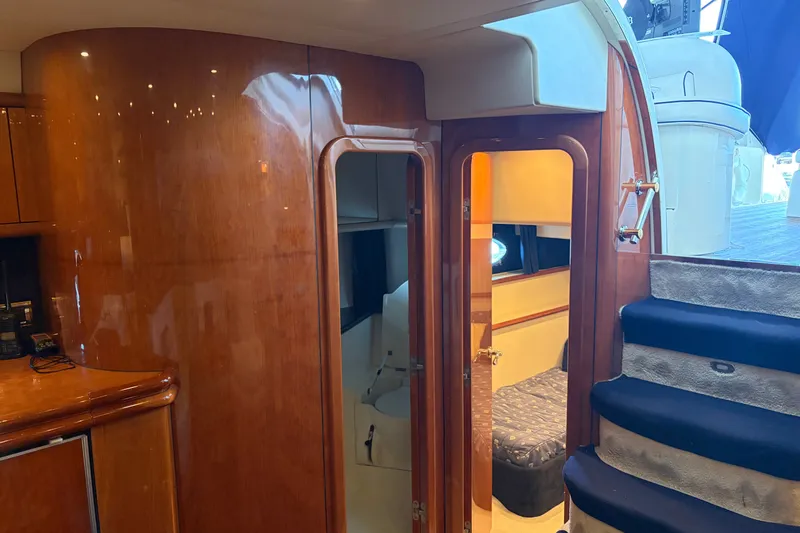Slide: The Image of Interior of 1997 Sunseeker Camargue 51 yacht with wooden finishes and staircase. - 30