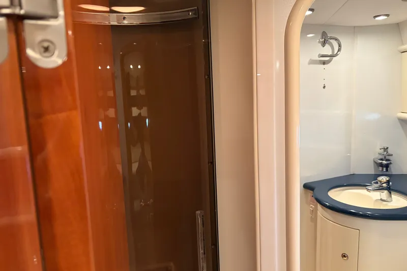 Slide: The Image of Luxurious bathroom interior of 1997 Sunseeker Camargue 51 yacht, featuring elegant fixtures. - 26