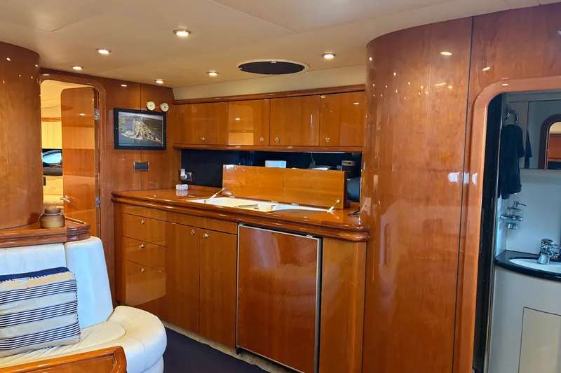 Slide: The Image of Luxurious interior of a 1997 Sunseeker Camargue 51 yacht with polished wood finishes. - 25
