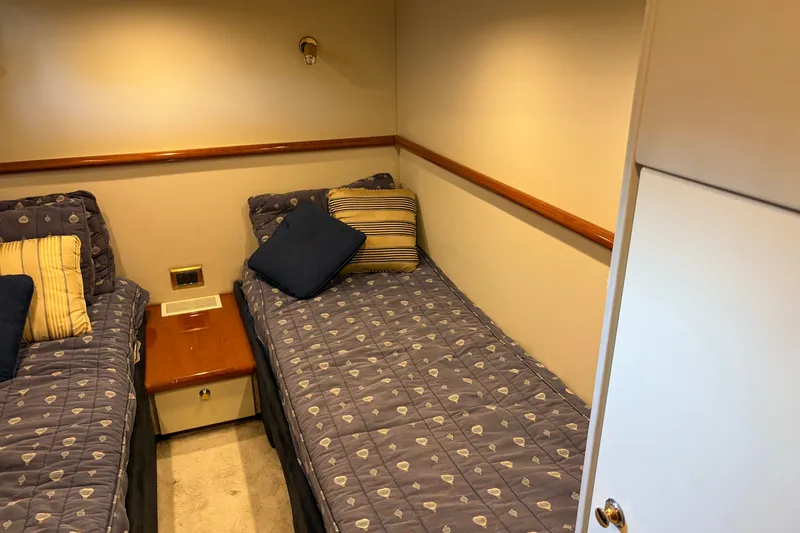 Slide: The Image of Cozy twin cabin in 1997 Sunseeker Camargue 51 yacht with patterned bedding. - 39