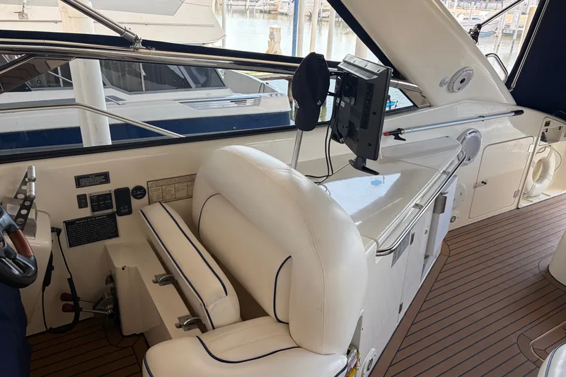 Slide: The Image of Interior of 1997 Sunseeker Camargue 51 yacht with helm station and seating. - 12