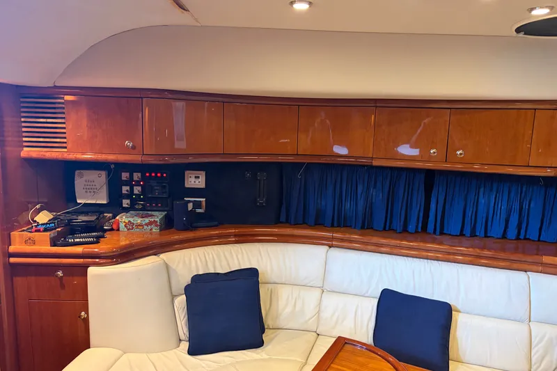 Slide: The Image of Luxurious interior of 1997 Sunseeker Camargue 51 yacht with plush seating and wooden cabinetry. - 29