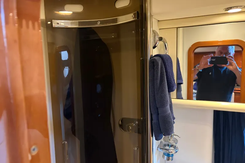 Slide: The Image of Bathroom interior of 1997 Sunseeker Camargue 51 yacht with mirror and towels. - 35