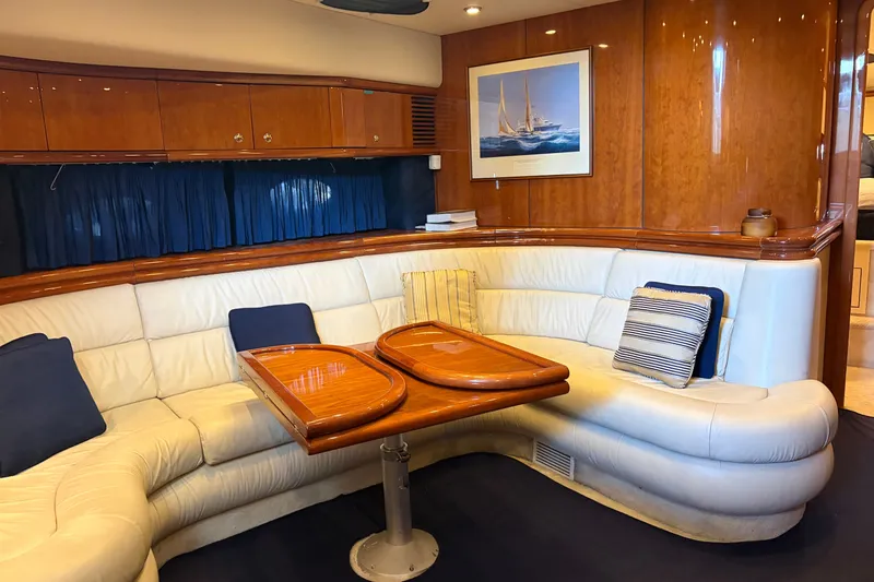 Slide: The Image of Luxurious interior of 1997 Sunseeker Camargue 51 yacht with elegant seating and wooden accents. - 28