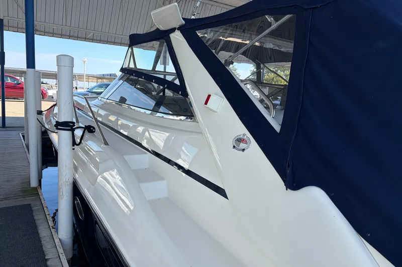 Slide: The Image of 1997 Sunseeker Camargue 51 yacht docked under a covered marina. - 6