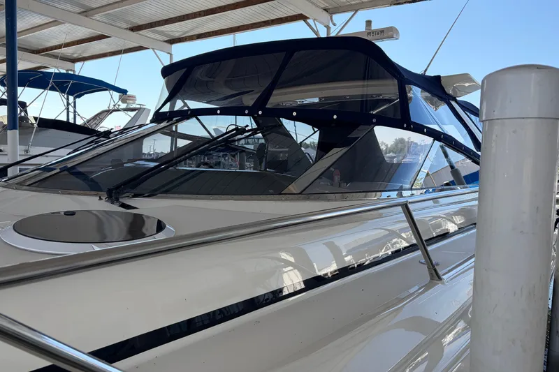 Slide: The Image of 1997 Sunseeker Camargue 51 yacht docked under a covered marina. - 9